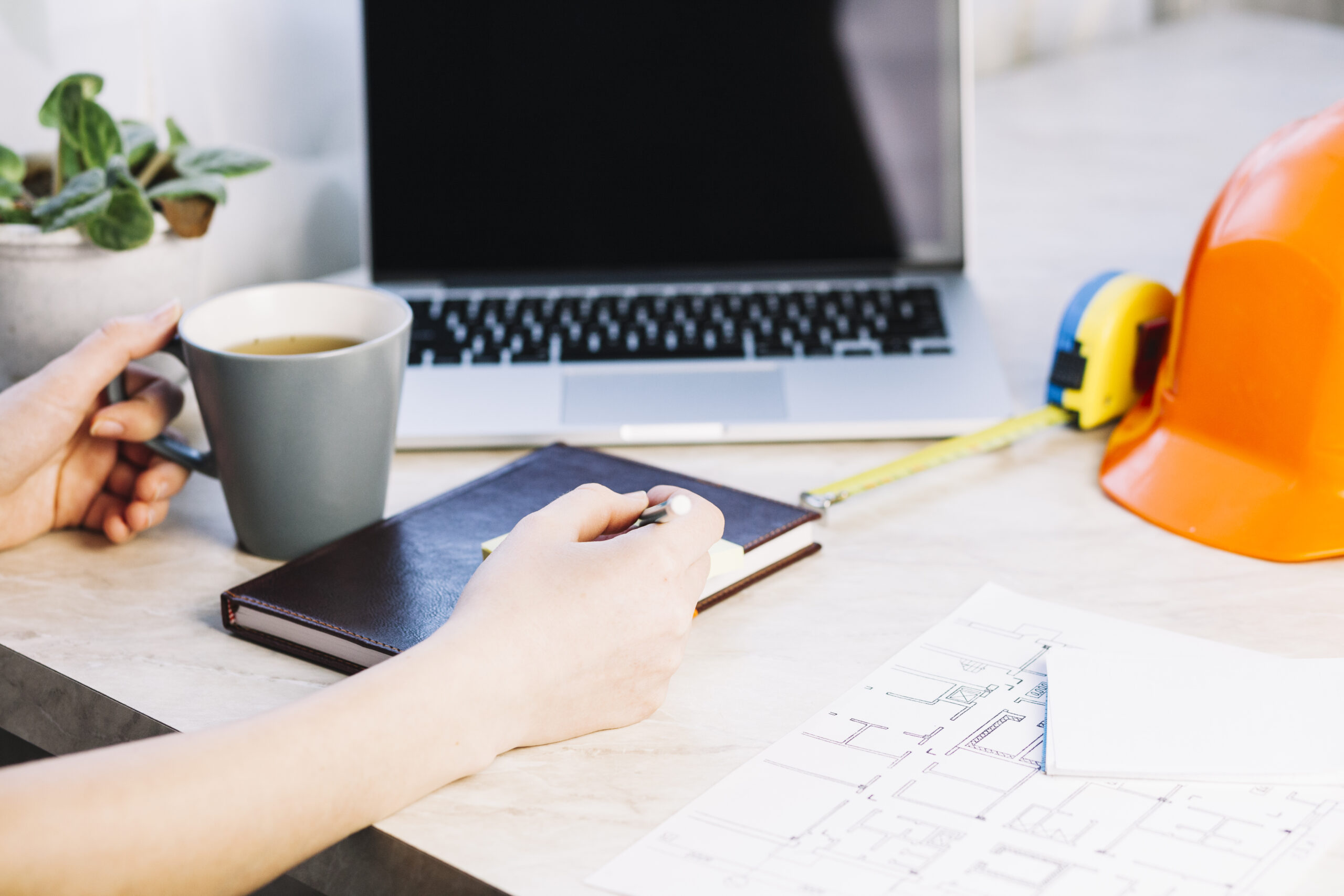 How SMEs benefit from electrical project management software illustrated by structured electrical planning using drawings, notes, and digital tools.
